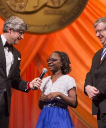 National Inventors Hall of Fame Induction Ceremony emcee Mo Rocca talks with Camp Invention alumna Mya Sewell and Inductee Eric Fossum